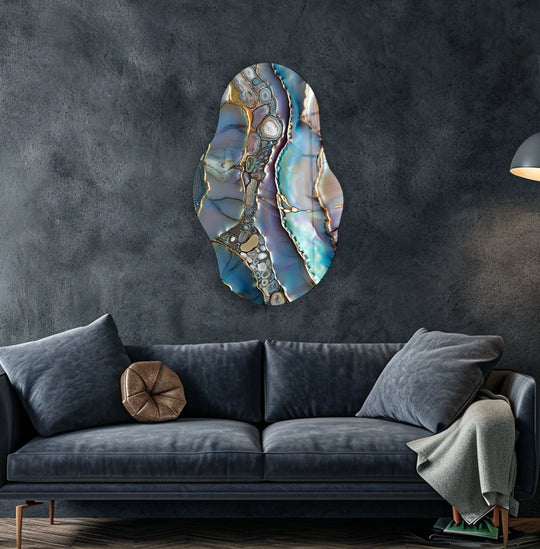 Abstract glass wall art features plush, velvety cushions on a sofa, evoking a sense of softness.