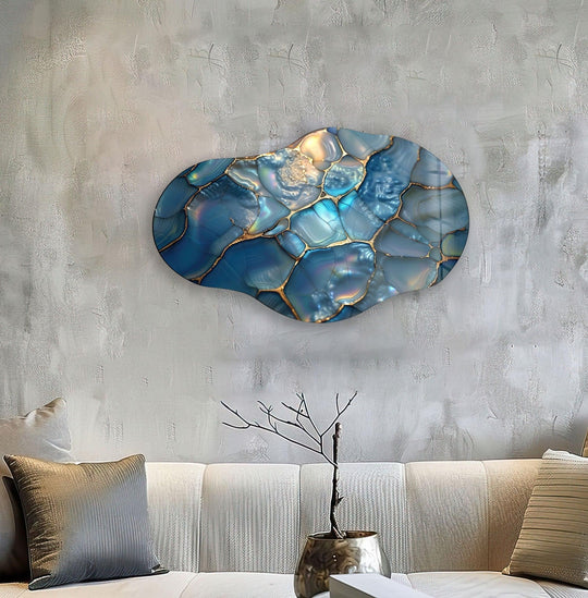 Textured abstract glass wall art features polished, irregular turquoise segments bordered by metallic gold, creating a mesmerizing surface texture.