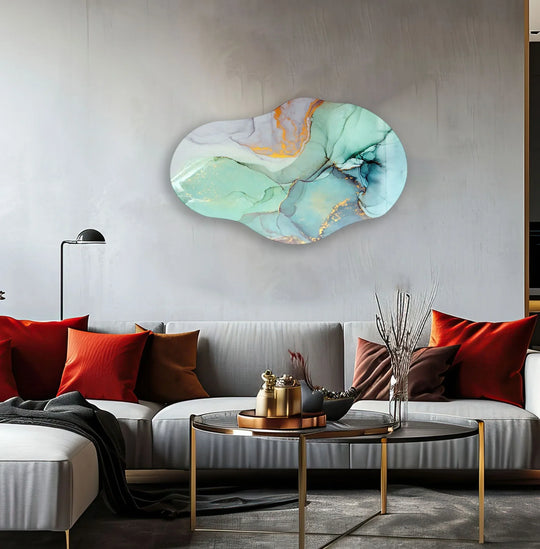 Irregular oval abstract turquoise glass wall art with a unique modern wall decor finish featuring swirling gold accents and fluid turquoise patterns.