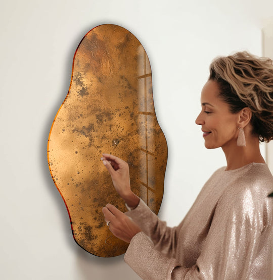 Visual rhythm flows through the copper-toned asymmetric glass wall artwork, echoing the free-flowing lines of the modern glass wall art.
