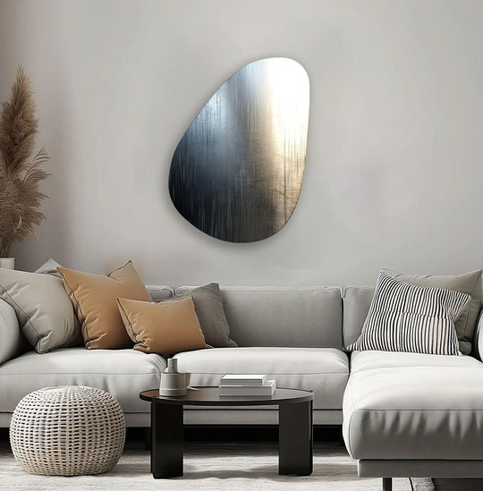 The metallic gray abstract glass print wall art features a sleek, rounded border that curves into a sharp edge.