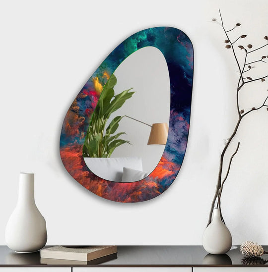An asymmetric mirror with an elegant abstract blue and red border serves as a decorative wall mirror and an irregular wall mirror on a white wall