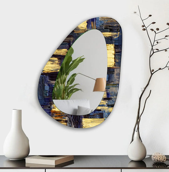 An asymmetric mirror with abstract gold and deep blue brushstrokes creates a unique decorative wall mirror