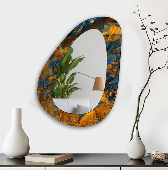 Seamless transitions of ultramarine and amber hues accent this asymmetric living room wall mirror, perfect as a contemporary bathroom mirror with a fluid, artistic design.