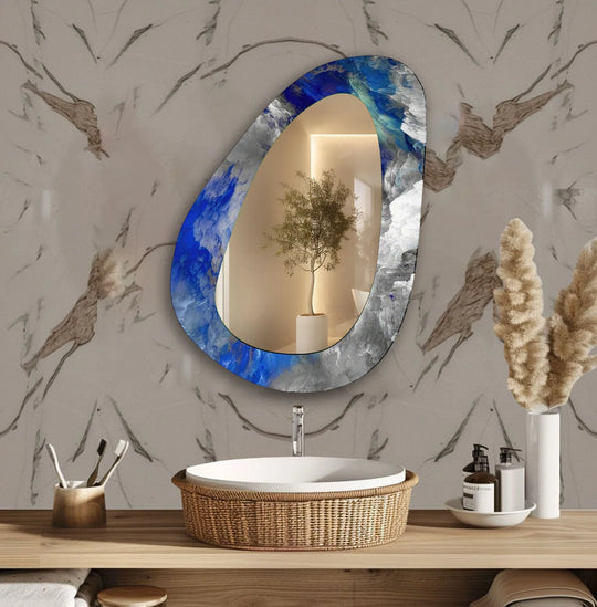 Featuring an abstract finish, this asymmetrical blue glass wall mirror appears as a modern stained glass wall mirror with swirling, painterly details.