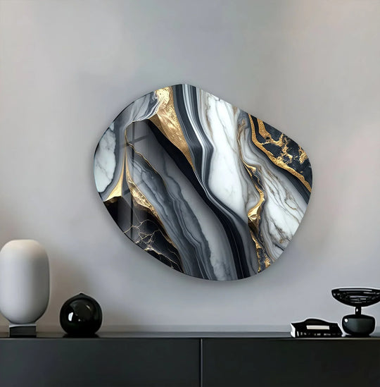 An abstract marble dark gray oval glass wall art with gold accents serves as the focal point for this unique wall art prints.