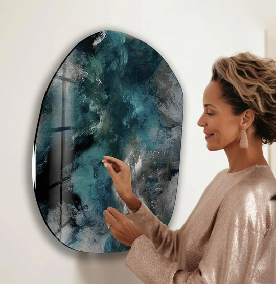 Oval glass art captures the organic forms of swirling emerald and sapphire ocean depths, a beautiful abstract wall art piece.