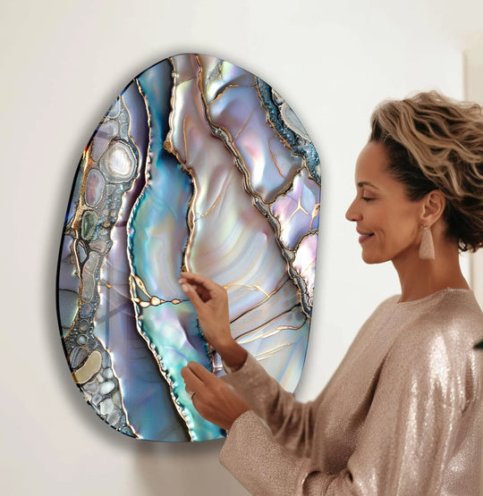 Woman admires a sparkling purple abstract glass wall art piece, adding a touch of luxury home decor.