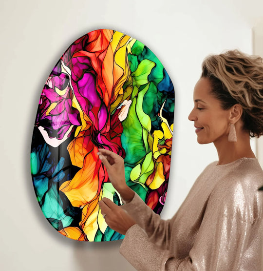 The softest element of this fuchsia watercolor oval glass wall art is the gradient of smooth, blended colors that appear to flow like liquid.