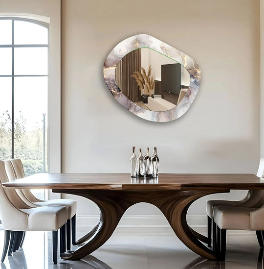 Asymmetric gray abstract wall mirror for wall decor features irregular geometric shapes within its patterned border, reflecting the room's simple lines.
