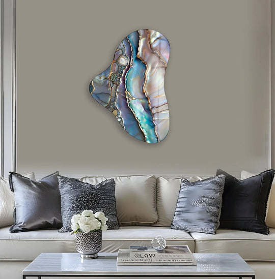 Abstract asymmetric decorative wall art features swirling layers of iridescent purple, blue, and gold, creating a mesmerizing depth.