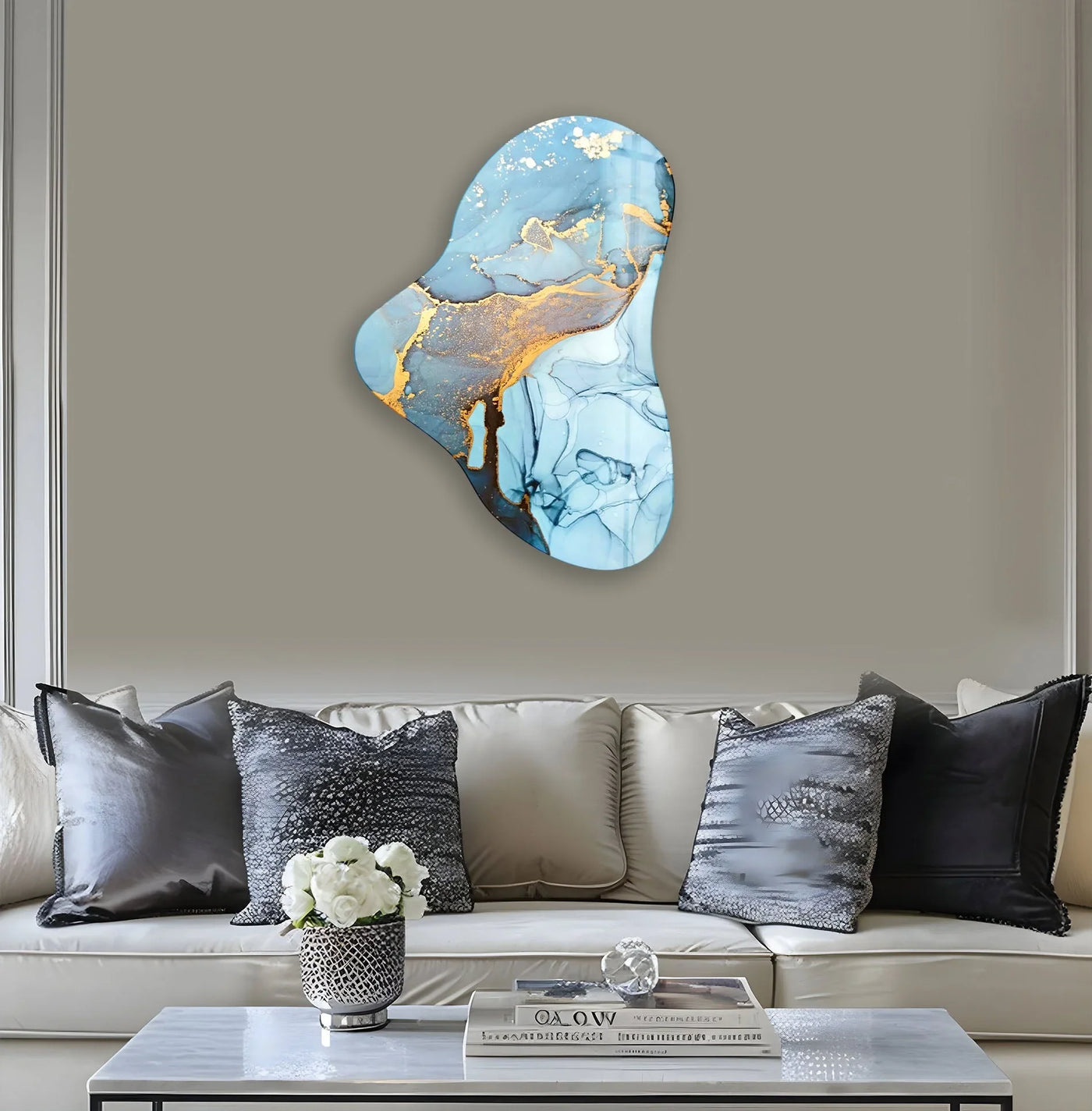 Abstract light blue asymmetrical glass wall art prints featuring fluid blue tones and golden accents.