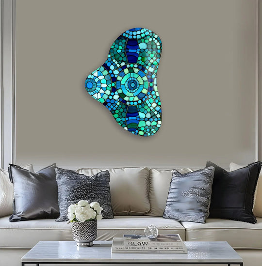 Deep, layered mosaic patterns in vibrant blues and greens create a stunning asymmetric glass print wall art.