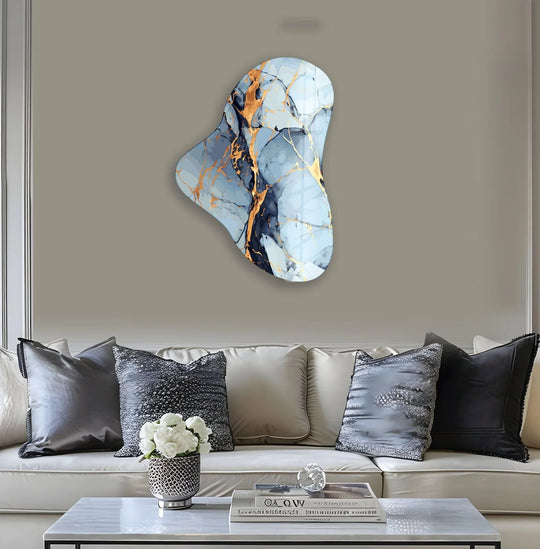 Abstract asymmetric decorative wall art featuring blue marble with striking gold veining.