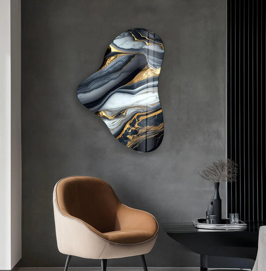 An asymmetric hanging wall art with organic gold-accented gray marble patterns.