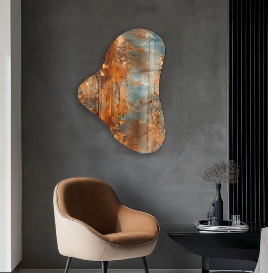 An abstract grey and brown glass wall art piece with a distressed texture, part of modern home decor.