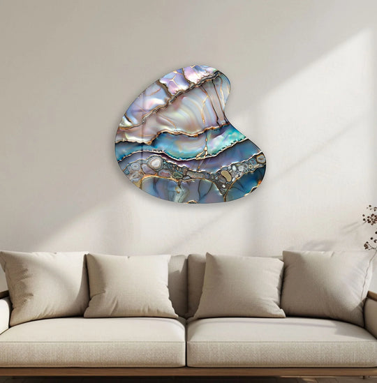 A still abstract glass wall art features swirling lavender and azure layers edged with metallic gold.