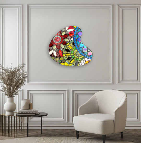 Vibrant multi-colored mosaic pattern glass wall art decor with a dominant jewel-toned blue and yellow hue.