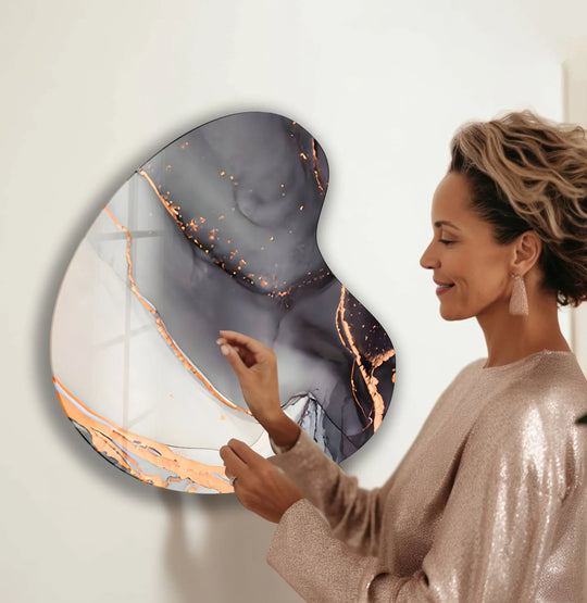 Dark gray and shimmering gold abstract shapes dominate this unique modern wall decor piece.