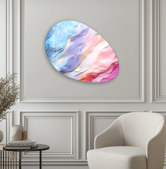 A close-up of swirling, textured pink and blue abstract print wall art with wavy, smooth ridges and a glossy surface.