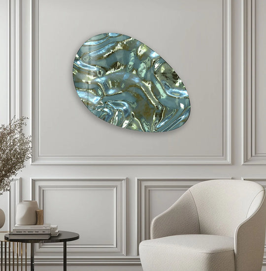 Abstract oval decorative wall art features rippling metallic light and shadow play across its textured glass surface.