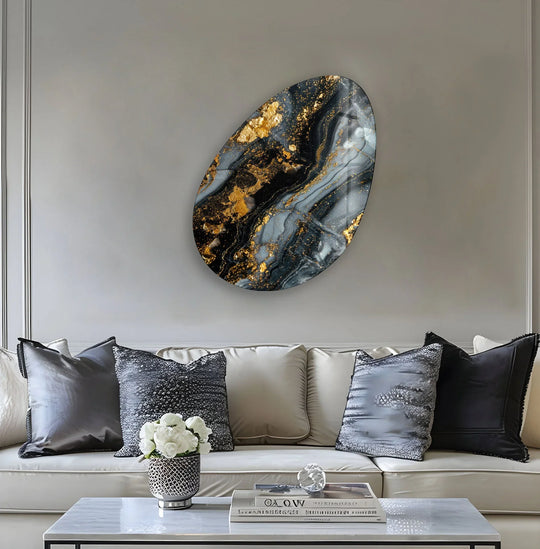 Dark, swirling ebony tones accented with shimmering gold define this oval glass art piece.