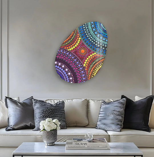 Oval glass print wall art exhibits a dynamic visual rhythm of colorful dots in circular patterns.