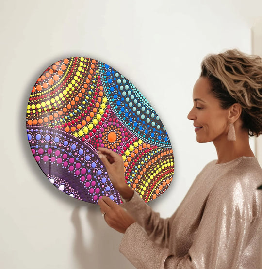 The vibrant glass art features a pink marble pattern with soft shadows highlighting its oval form and dynamic dots.