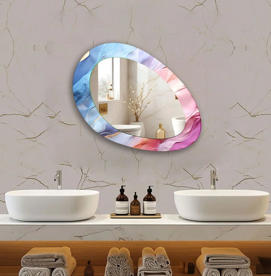 An asymmetric wall mirror displays a pink and blue abstract design reflecting a modern bathroom with dual sinks