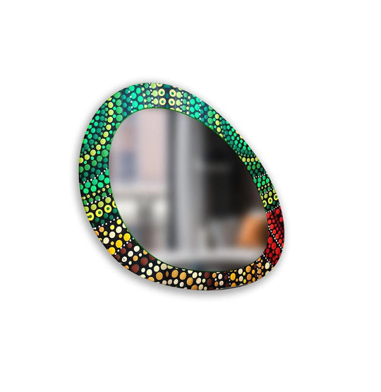 Subtle gradations within the mosaic dots are the softest element of this asymmetrical wall mirror, a vibrant choice for decorating with wall mirrors.