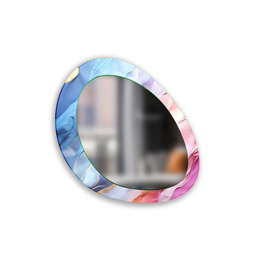 An asymmetric mirror features abstract pink and blue patterns on a tempered glass surface creating a modern wall accent