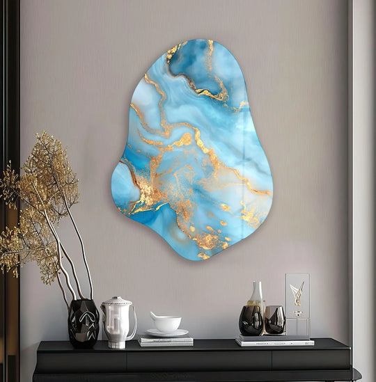 A striking abstract glass printing piece with swirling azure and gold veins creates a dynamic visual rhythm against a neutral wall.