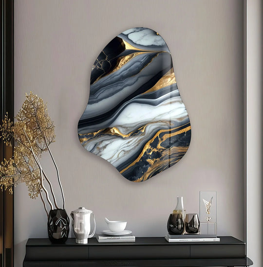 Irregular glass printing with marbled grey and gold tones creates a fluid visual rhythm across the abstract wall art.