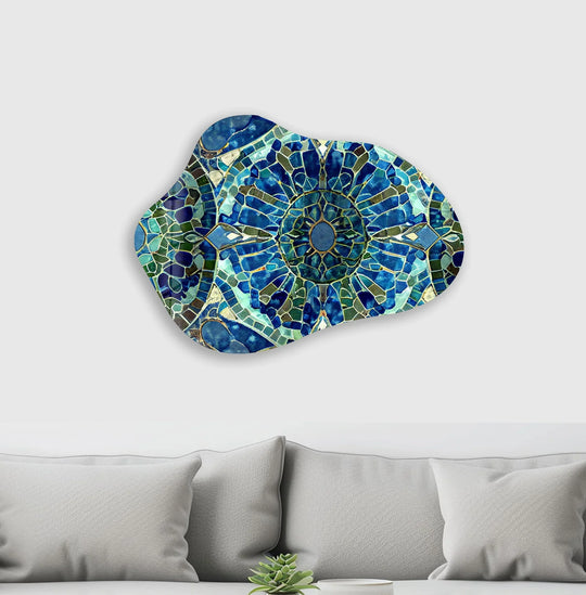 Symmetrical glass print wall art features a central blue mosaic design against a vast expanse of white negative space.