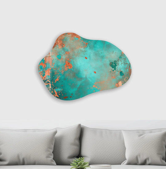 Turquoise abstract decorative wall art is set against a plain white background above a soft gray sofa.