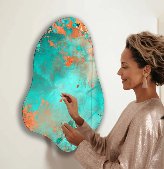 Organic forms in a turquoise abstract decorative glass art painting evoke the ebb and flow of a tranquil sea.