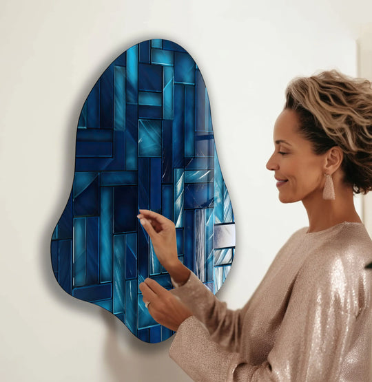 The abstract blue mosaic tiles glass wall art features a distinctive irregular edge with a subtle border.