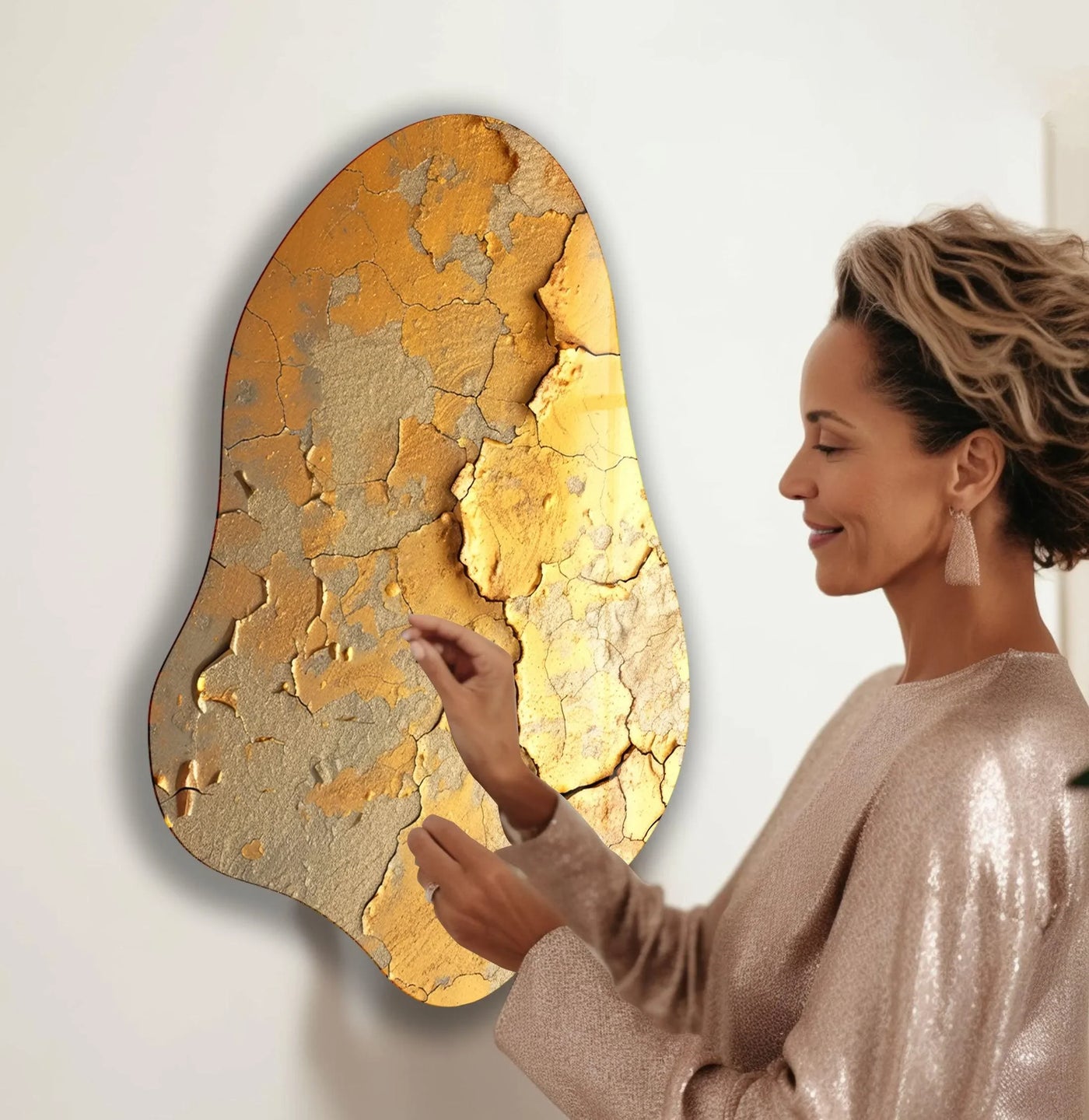 Elegant gold decorative glass wall art featuring a textured transition of golden hues and cracked earth tones on wall prints.