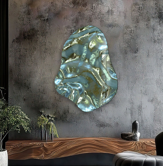 An abstract green glass hanging wall art piece with swirling, iridescent textures in the center.