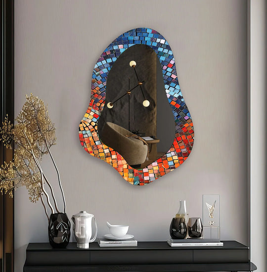 Highlighting its abstract quality, this decorative wall mirror features a colorful mosaic border, reflecting the modern wall mirrors trend in unique home decoration.