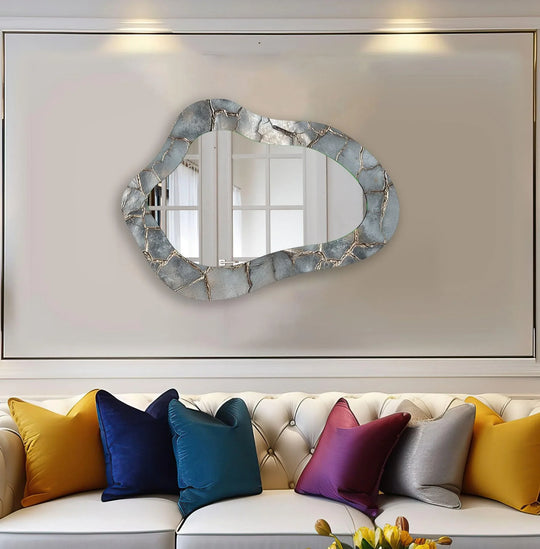 Framed by neutral walls and soft spotlights, a window reflected within the metallic grey wall mirror offers subtle decorating with wall mirrors inspiration.