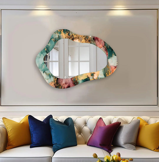 Abstract stained glass wall mirror reveals an organic-shaped border with swirling green, gold, and pink alcohol ink patterns, reflecting artistic quality.