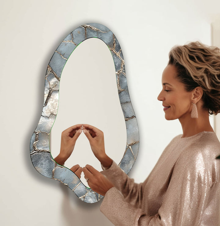 Mirror wall art with abstract shapes and reflective surfaces for a modern artistic vibe
