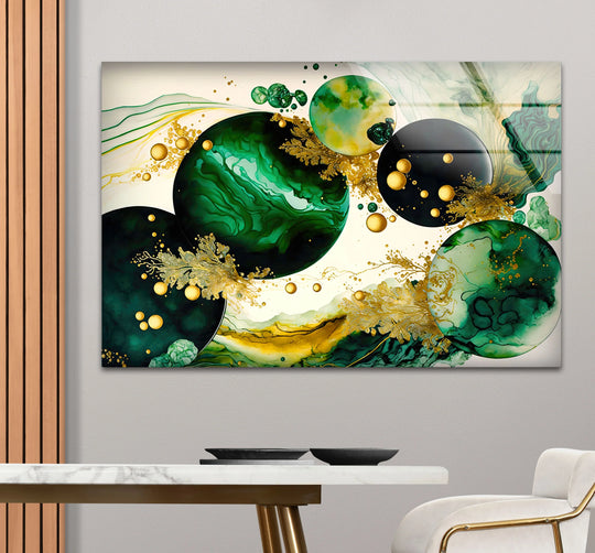 Modern luxury glass wall artwork with an emerald and gold abstract design, featuring sleek edges against a wall.