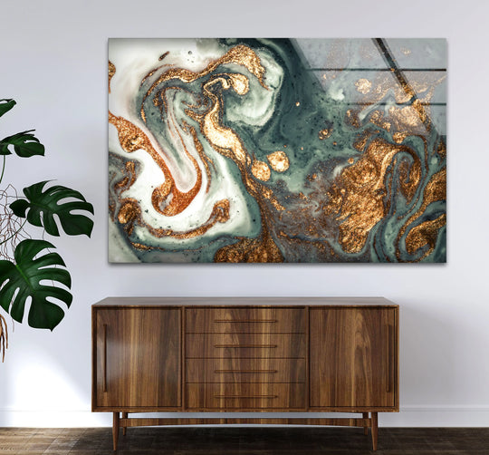 Abstract glass wall artwork showcasing a mesmerizing swirl of emerald, gold, and white marble patterns.