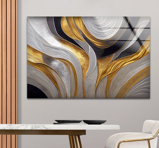 The dominant abstract glass art features swirling silver and gold waves with a luxurious, fluid texture.