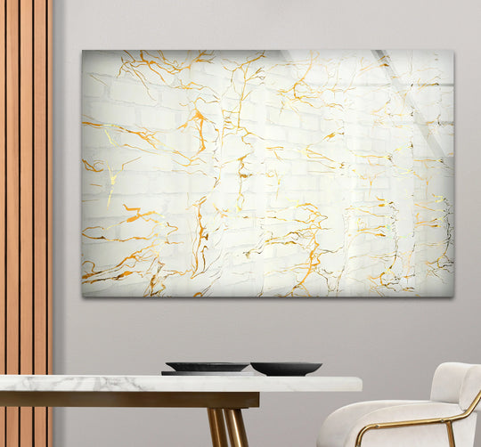Bold gold veins contrast with white marble texture on this striking decorative wall art.