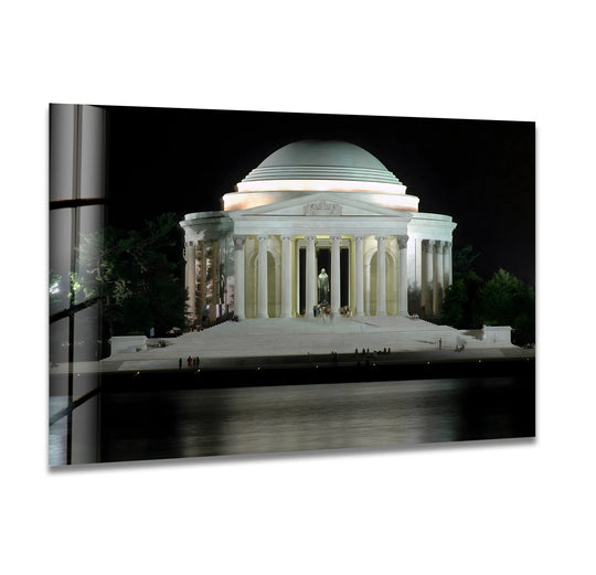 Night water reflections enhance this Jefferson Memorial glass wall art with soft, serene wall prints depicting a majestic nighttime view.