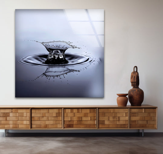 Monochrome glass art painting captures a dramatic water splash effect with distinct layers of water and reflections.