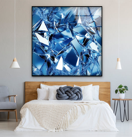 The brightest area of this glass wall art decor showcases shattered, faceted ice in brilliant sapphire tones.
